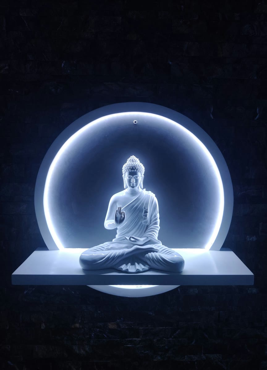 Illuminated seated Buddha statue